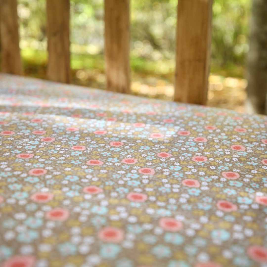 crib sheet brown with pink flowers in wooden crib